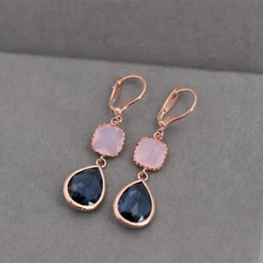 Elegant earrings featuring rose quartz and blue sapphire drops