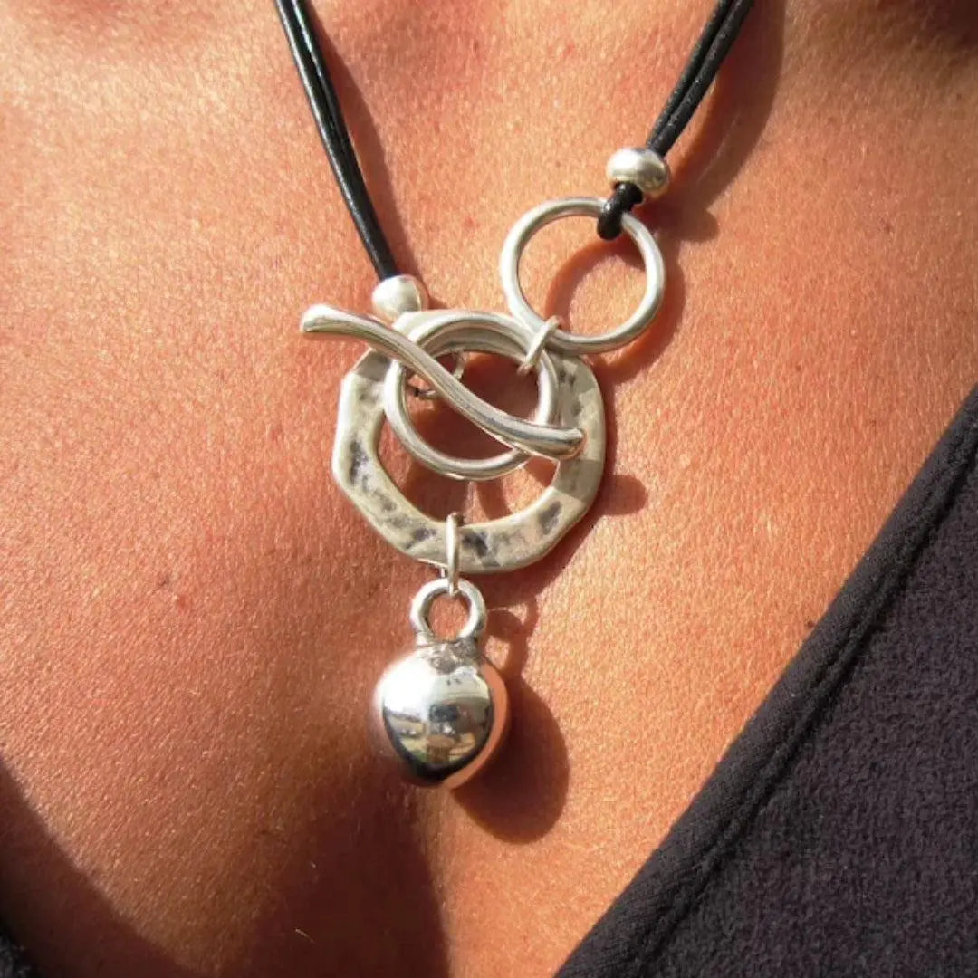 Statement Necklace with Hammered Finish and Sparkling Pendant