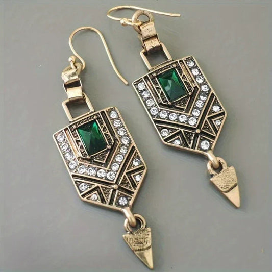 Vintage earrings with an emerald-green stone and sparkling crystals