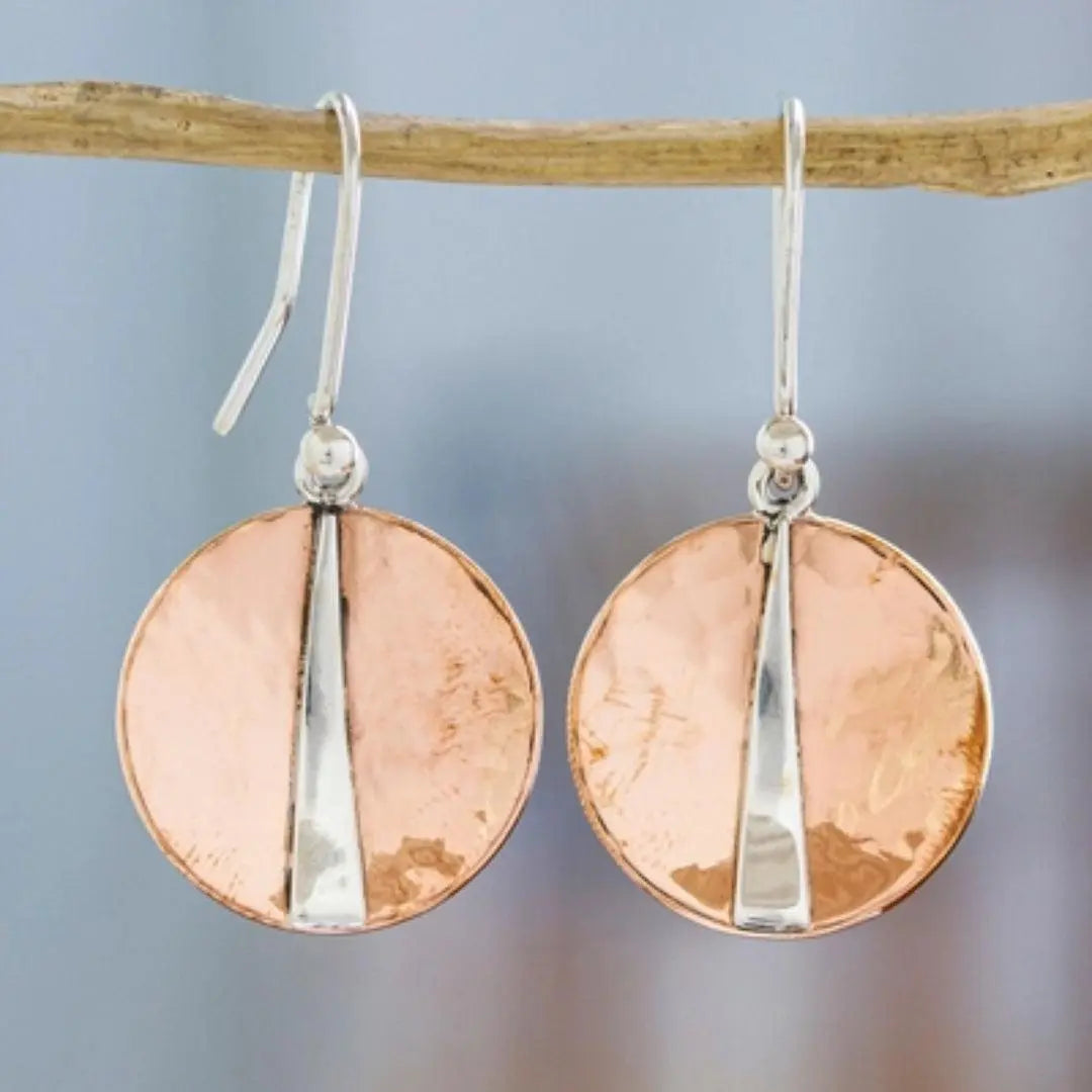 Hammered copper earrings with a narrow, modern brass strip