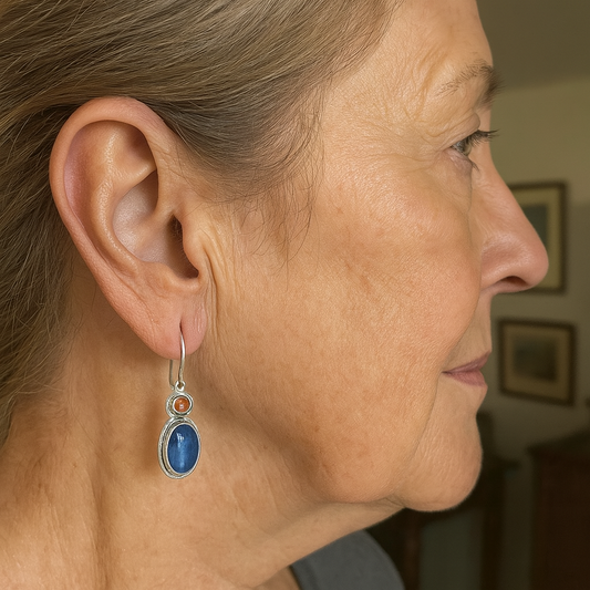 Oval blue kyanite earrings with shiny amber details