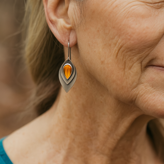 Vintage matt metal earrings with an orange teardrop-shaped stone