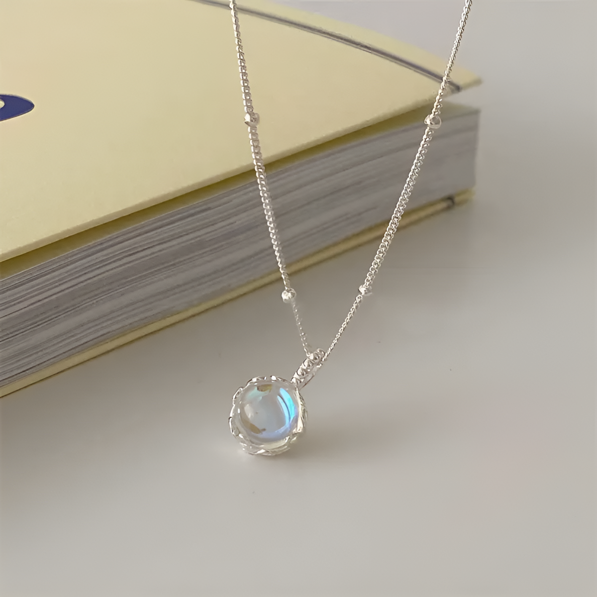 Elegant Moonstone Necklace with Filigree Setting and Delicate Chain