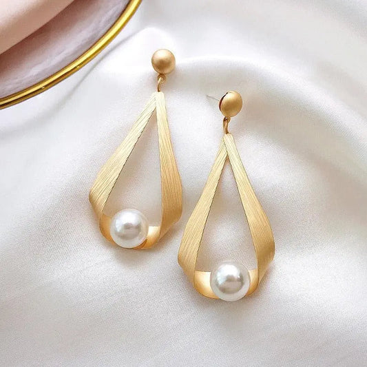 Elegant Matte Gold-Tone Pearl Earrings with Floating Details