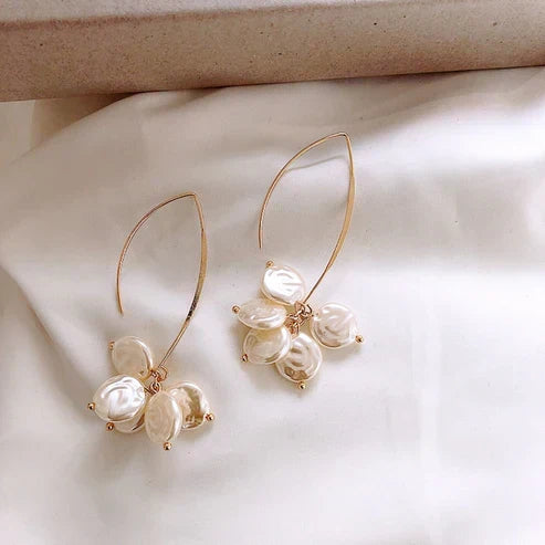 Elegant earrings featuring baroque pearls and a dazzling sheen