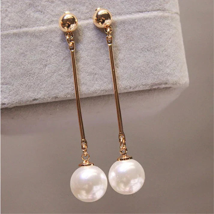 Elegant pearl earrings: long teardrop shape with a bar detail
