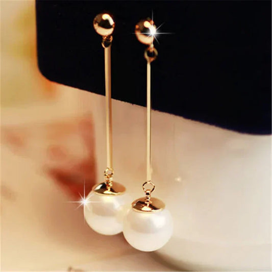 Elegant pearl earrings: long teardrop shape with a bar detail