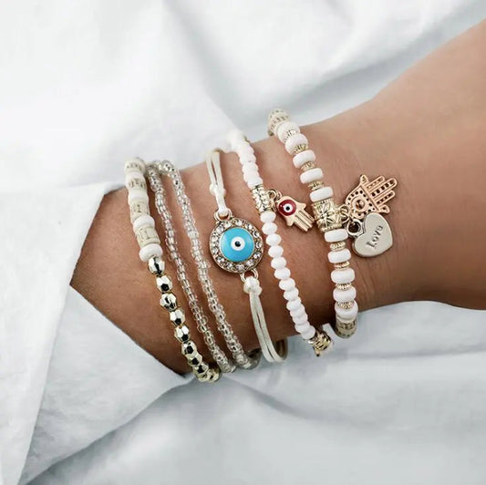 Boho bracelet set featuring a Nazar eye, a Hamsa and beads