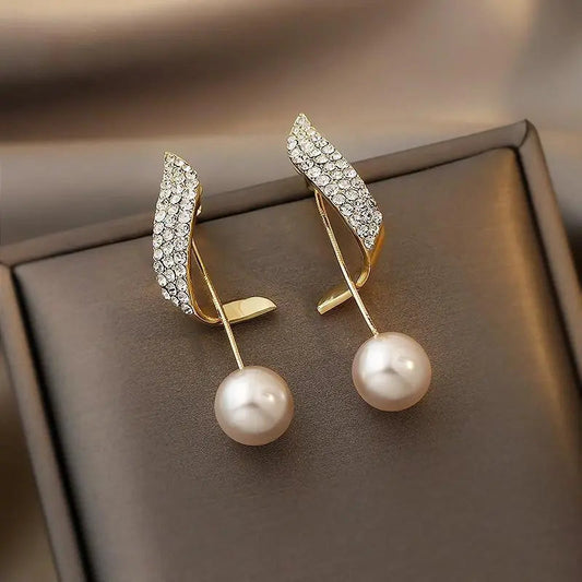 Elegant pearl earrings with sparkling rhinestone details for women