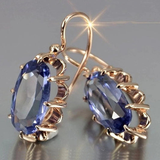 Elegant Hook Earrings with Faceted Oval Blue Gemstone