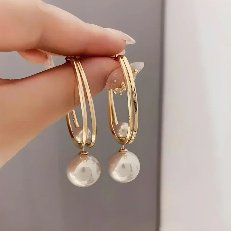 Elegant pearl earrings with a double-hoop design for women