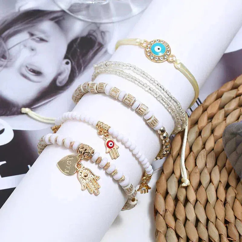 Boho bracelet set featuring a Nazar eye, a Hamsa and beads