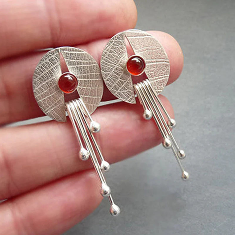Artistic Earrings with Deep Red Stone and Modern Dangle Elements
