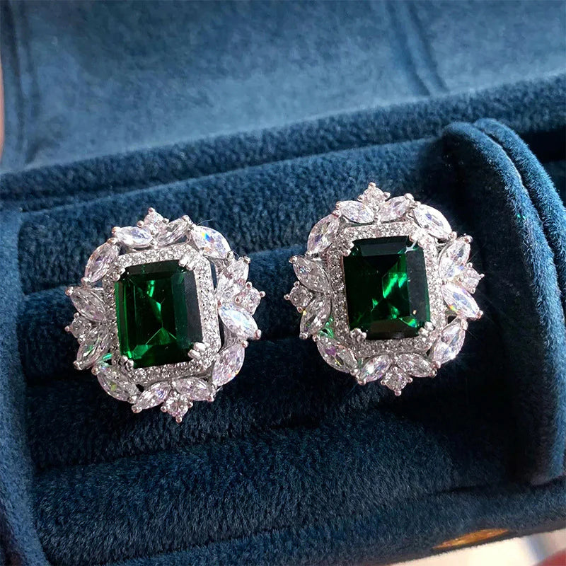 Luxurious earrings featuring emerald-green cubic zirconia and sparkling marquise-cut stones