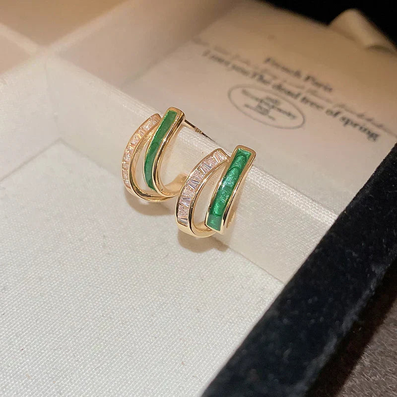 Elegant hoop earrings with bright green enamel and sparkling cubic zirconia stones