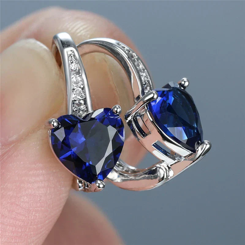 Heart-shaped earrings with sapphire-blue cubic zirconia and sparkling details