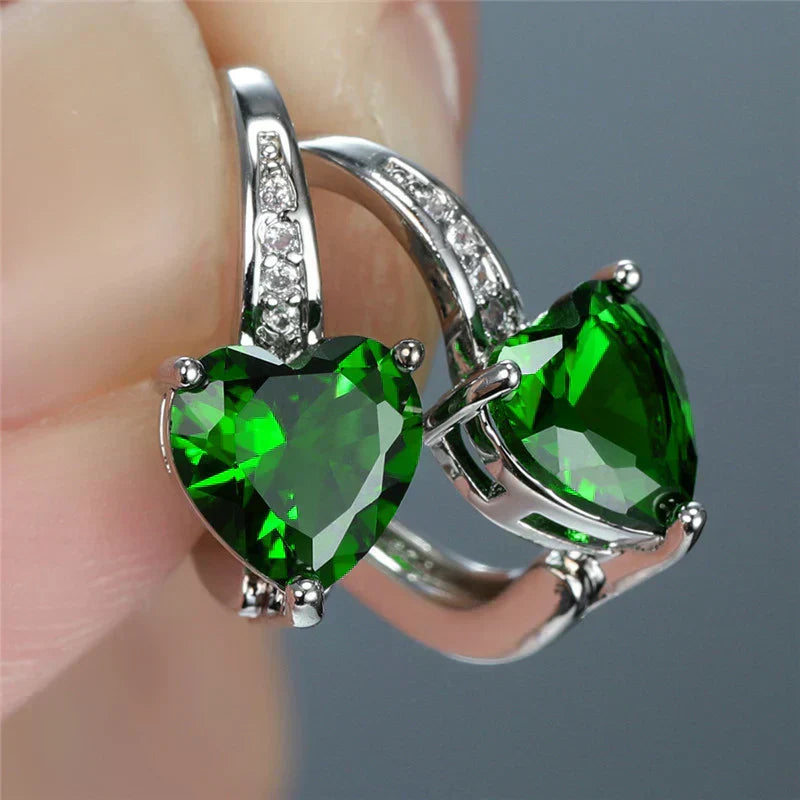 Elegant heart-shaped earrings with emerald-green cubic zirconia stones