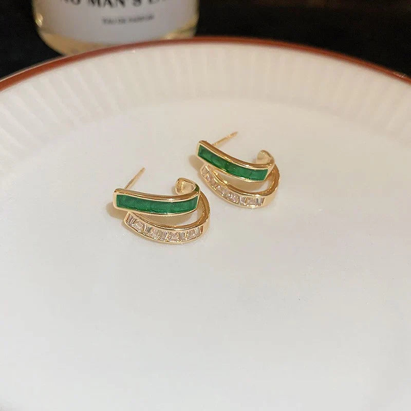 Elegant hoop earrings with bright green enamel and sparkling cubic zirconia stones