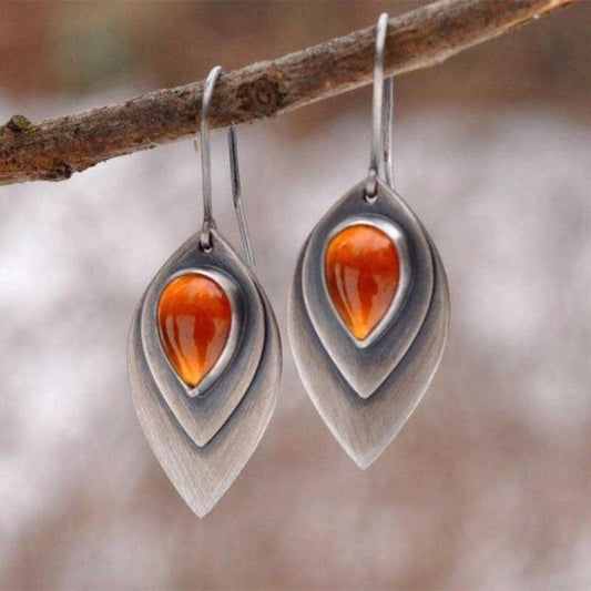 Vintage teardrop earrings with a bright orange stone