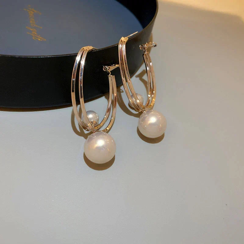 Elegant pearl earrings with a double-hoop design for women