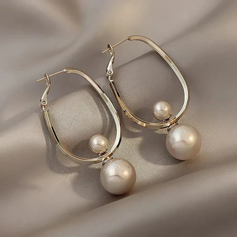 Elegant pearl earrings with a double-hoop design for women