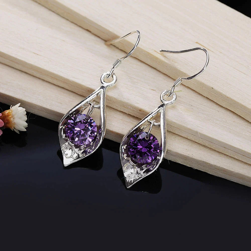 Shimmering violet crystal earrings with an elegant teardrop design