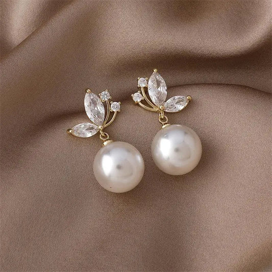 Elegant leaf-shaped earrings with sparkling crystals and pearls