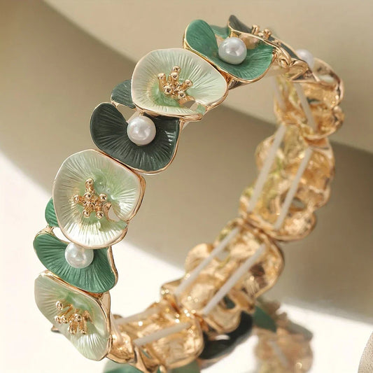 Vintage bracelet featuring elegant green floral motifs and lovely pearls