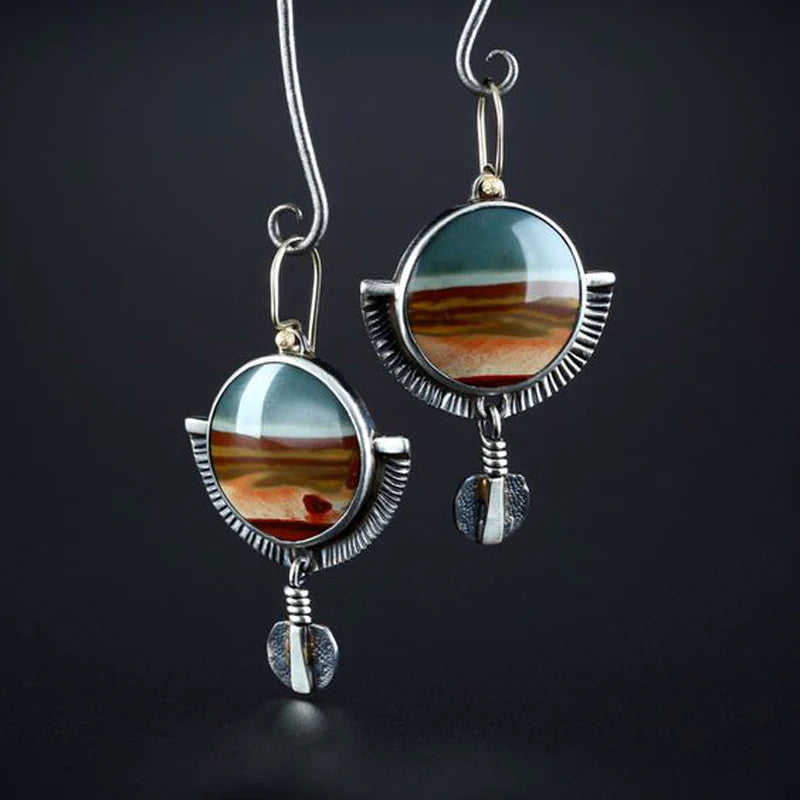 Handmade jasper earrings featuring a crescent moon design and an aged finish