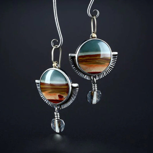 Handmade jasper earrings featuring a crescent moon design and an aged finish