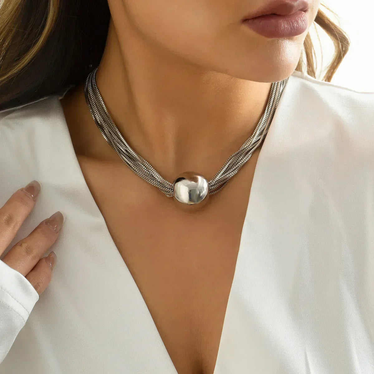 Elegant Multi-Row Necklace with Shimmering Metal Ball Pendant