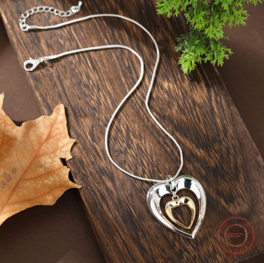 Two-Tone Heart Necklace with Delicate Interlocking Heart Pendant