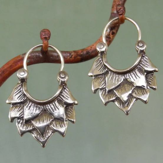 Antique ethnic spiral earrings with ornate Celtic motifs
