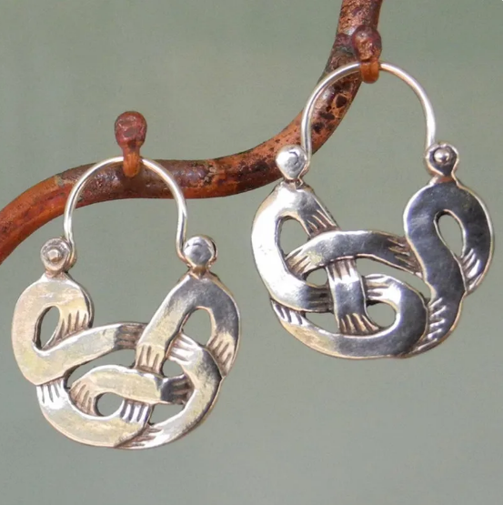Antique ethnic spiral earrings with ornate Celtic motifs