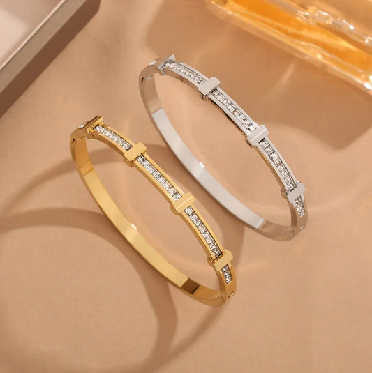 An elegant bracelet featuring a double row of cubic zirconia stones and a geometric design