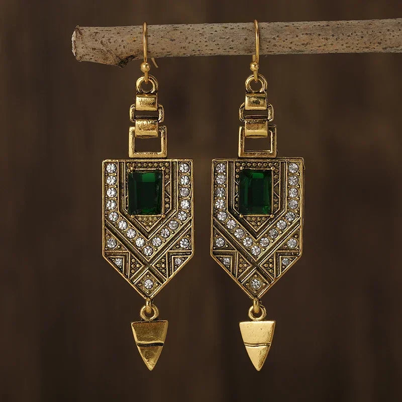 Vintage earrings with a geometric design and sparkling green stones
