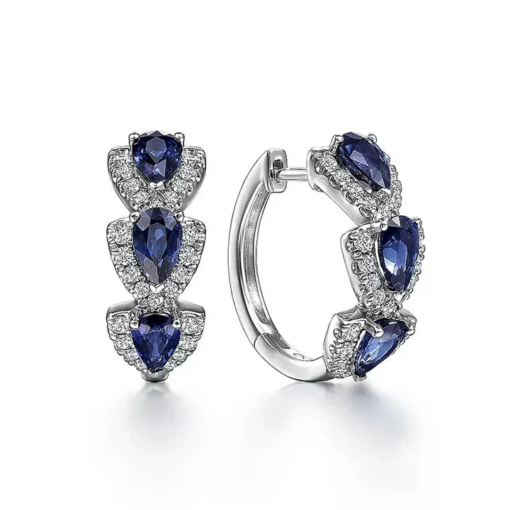 Elegant earrings featuring blue sapphire teardrops and sparkling cubic zirconia stones