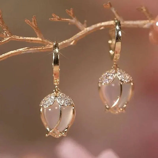 Elegant earrings with a white stone and cubic zirconia