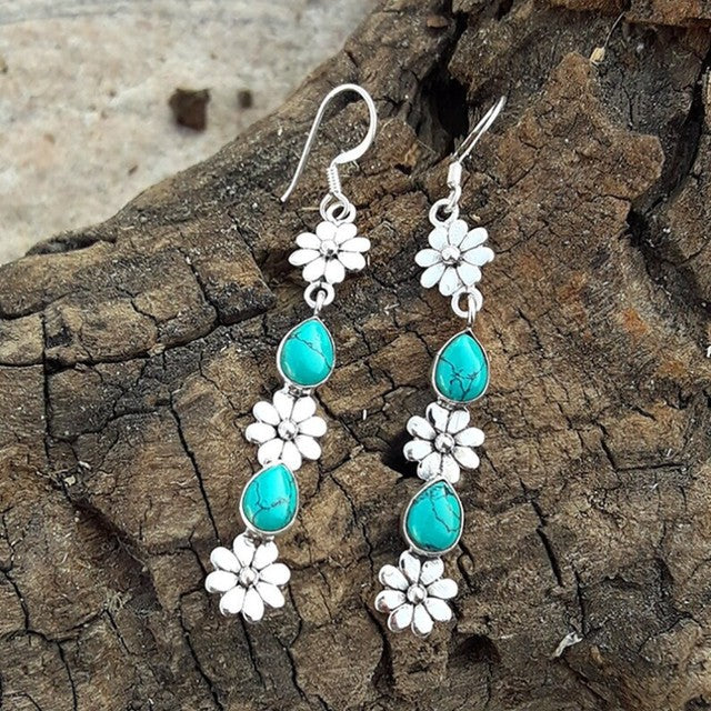 Turquoise gemstone earrings with floral motifs