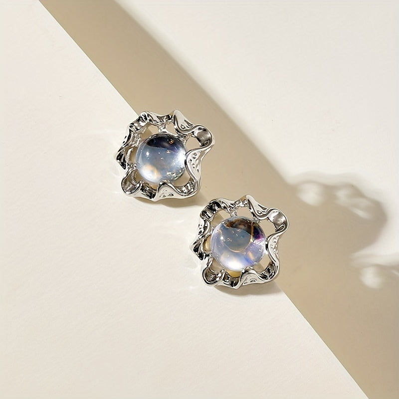 Moonstone earrings with an organic, wavy design