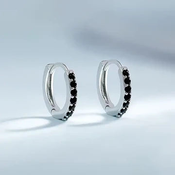 Shiny fold-over hoop earrings with coloured cubic zirconia: versatile and elegant