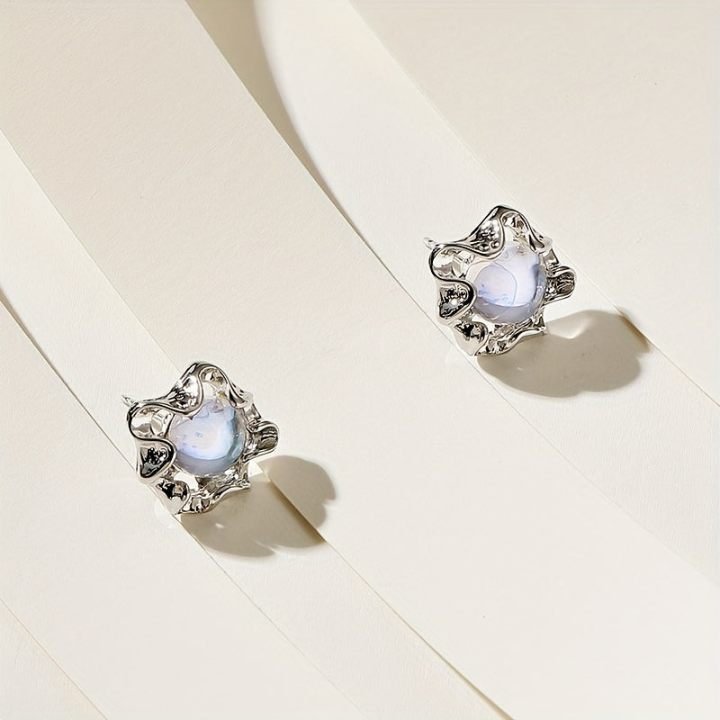 Moonstone earrings with an organic, wavy design