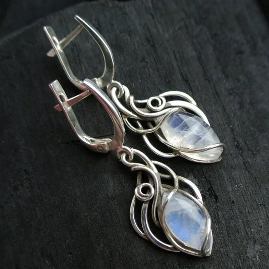 Elegant earrings featuring iridescent moonstone and artistic wire mesh