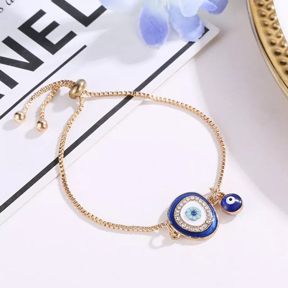 Adjustable bracelet with a blue Nazar eye and cubic zirconia stones