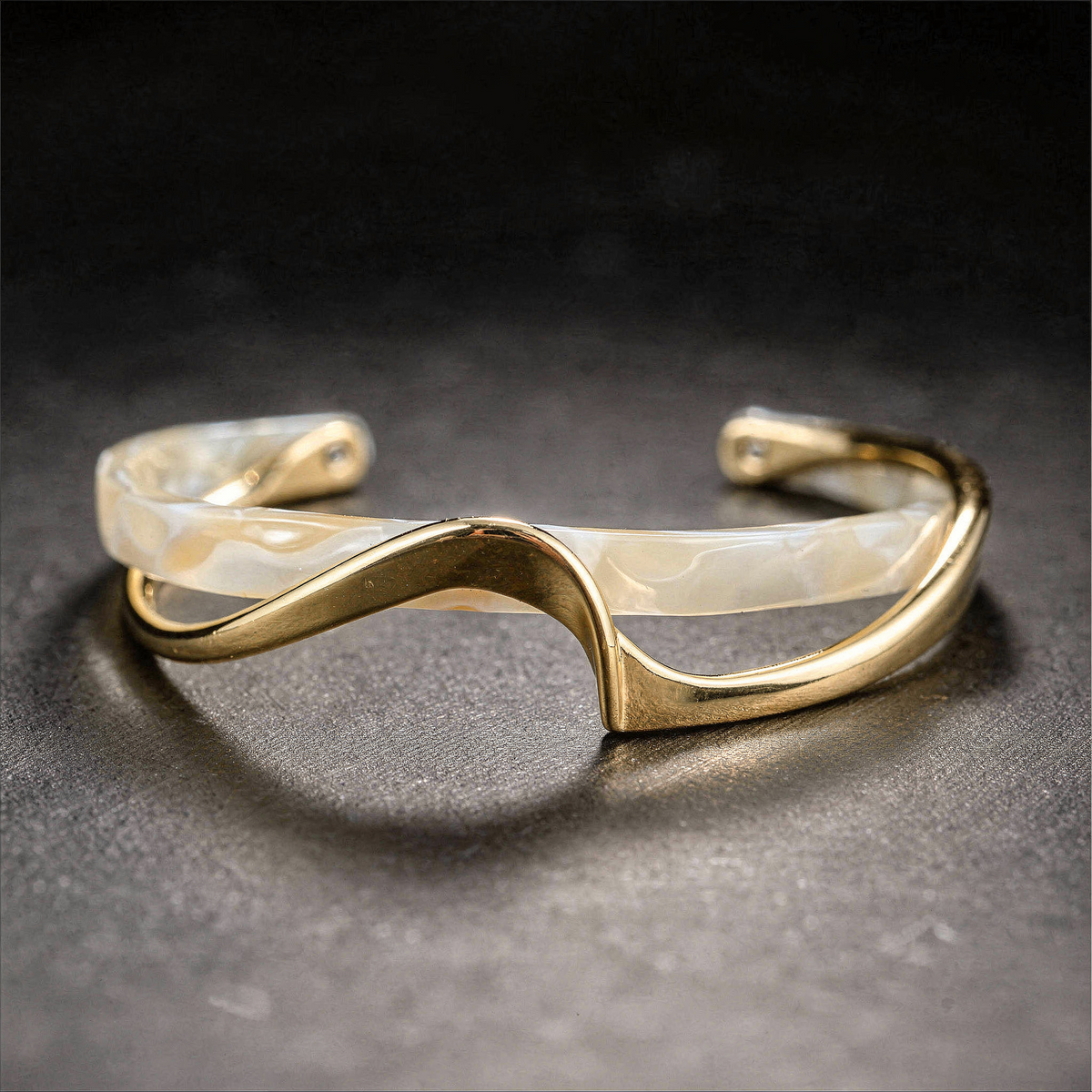 Modern bracelet with a wave-pattern design in mother-of-pearl and metal