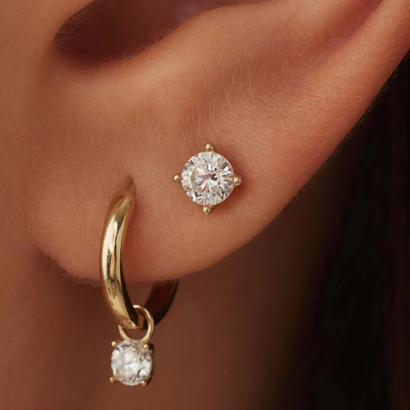 Earrings featuring sparkling cubic zirconia stones in a classic pointed setting