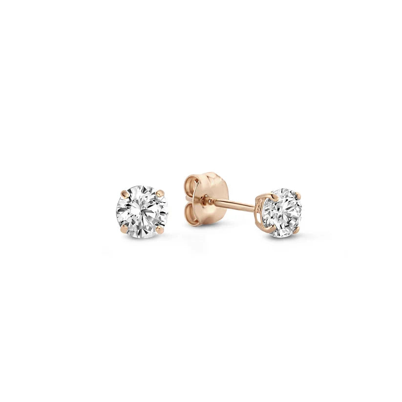 Earrings featuring sparkling cubic zirconia stones in a classic pointed setting
