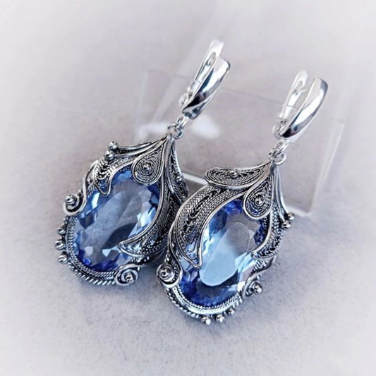 Elegant teardrop-shaped earrings with sparkling blue crystals