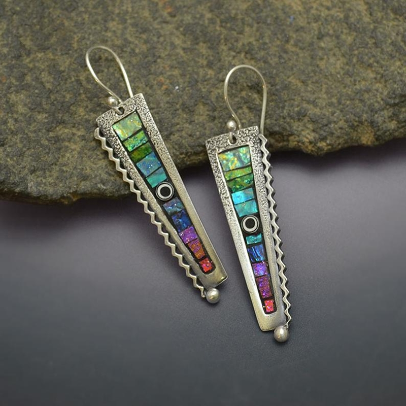 Vintage-inspired earrings set with multicoloured gemstones and featuring a textured setting