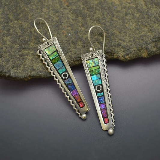 Vintage-inspired earrings set with multicoloured gemstones and featuring a textured setting
